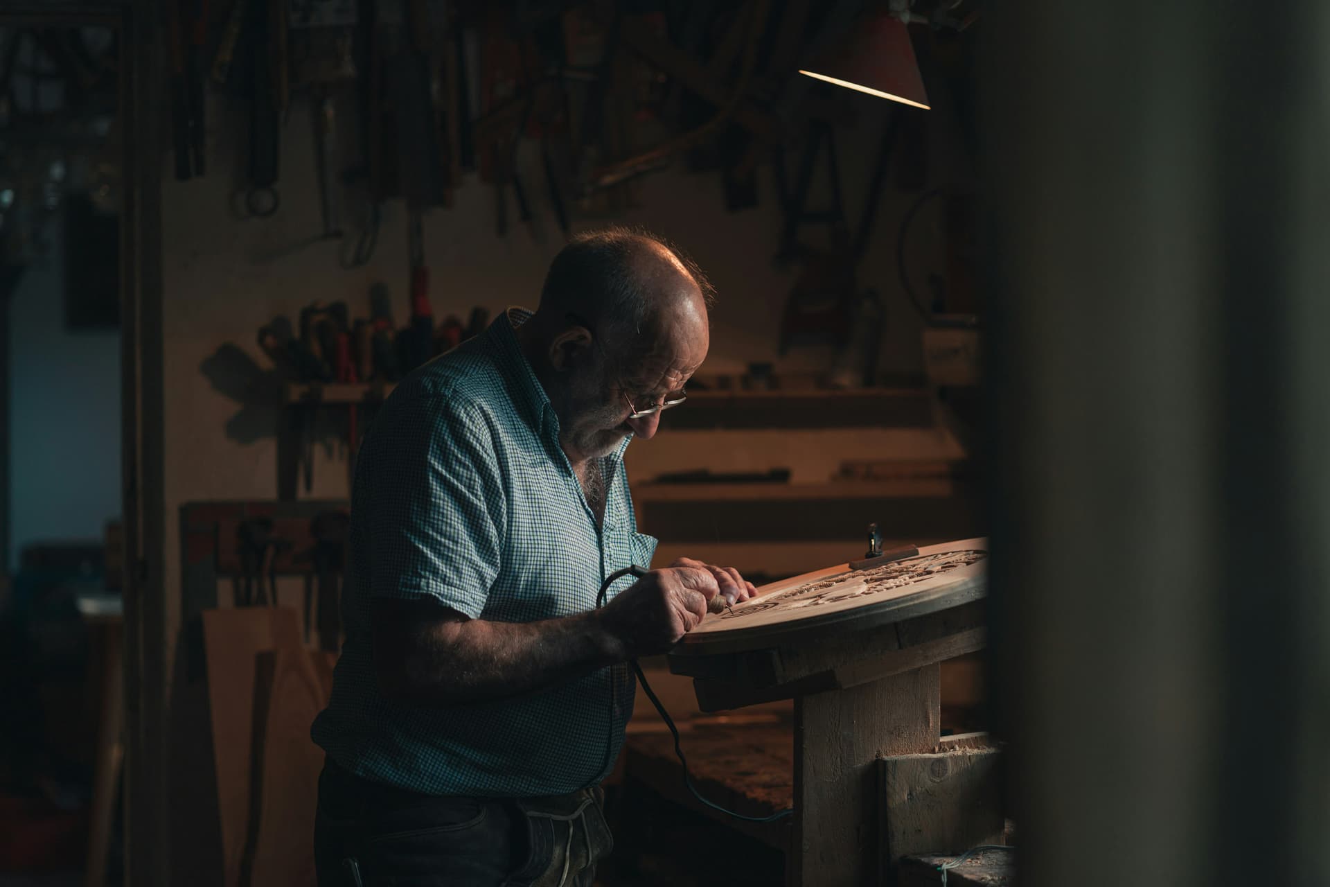 A cabinetmaker at the bench in the 7th Grain workshop