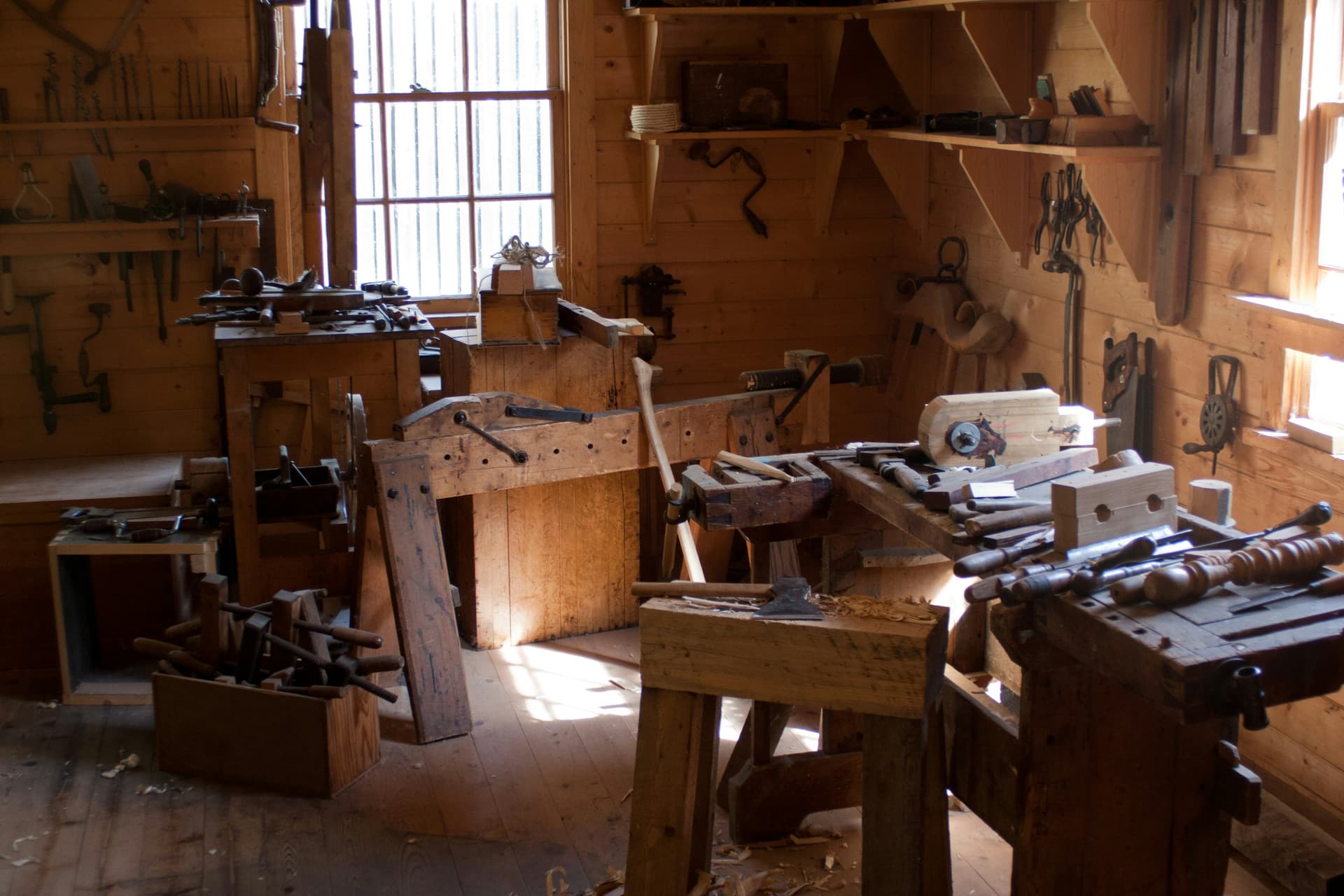 Hand tools and a part-built frame on the workshop bench